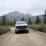 2024+ Ford F150 LightBar mounted on a rugged terrain with mountains in the background.