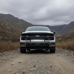 2024+ Ford F150 with 30in Light Bar PRO on a dirt road in mountainous terrain, showcasing off-road capabilities.