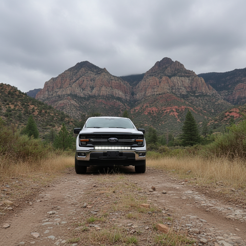 2024+ Ford F150 LightBar installed on truck in off-road setting with mountains in background.