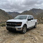 2024+ Ford F150 LightBar installed on a white Ford F150 in a mountain landscape.