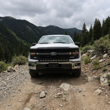 2024+ Ford F150 LightBar mounted on a rugged terrain, showcasing its off-road capability.