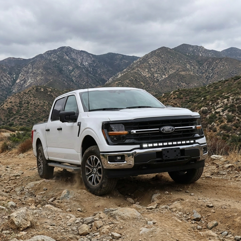2024+ Ford F150 LightBar mounted on a white truck in mountainous terrain perfect for off-road use.