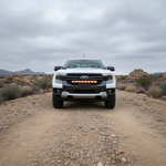 2024–2026 Ford Ranger parked on a rugged dirt road, 30-inch PRO LED light bar mounted in the grille