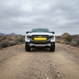 Front view of a white Ford Ranger on a dirt road with the grille-mounted 30-inch PRO LED light bar
