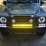 Ineos Grenadier XL light bar kit with the 30in center bar lit yellow and both 12in extensions lit white