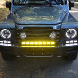 Ineos Grenadier XL light bar kit with the 30in center bar lit yellow and both 12in extensions lit white
