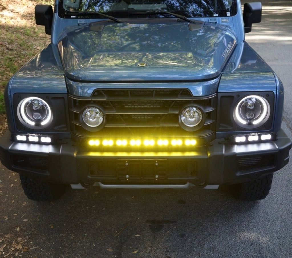 Ineos Grenadier XL light bar kit with the 30in center bar lit yellow and both 12in extensions lit white