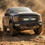 2021-2023 Ford F150 Tremor in dust with a single white 30in LED light bar mounted in the lower grille opening behind the Ford emblem