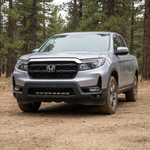 Passenger-side front three-quarter of a 2021-2026 Honda Ridgeline showing the 30in PRO light bar mounted low in the bumper, lights off