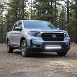 2021-2026 Honda Ridgeline front three-quarter on a forest trail with 30in PRO light bar lit white