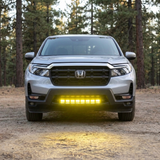 2021-2026 Honda Ridgeline front view with 30in PRO light bar in yellow casting light on the dirt ahead of the truck