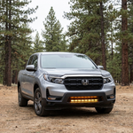 2021-2026 Honda Ridgeline front three-quarter with amber DRL backglow lit on the 30in PRO light bar