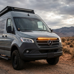 2019+ Mercedes Sprinter van in the desert with a 40in SLIM LED light bar glowing amber across the top of the grille