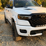 2026 RAM 1500 HEMI front corner close-up with 40in light bar PRO following the grille curve