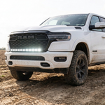 White 2026 RAM 1500 HEMI with 40in curved LED light bar PRO lit white, front three-quarter view