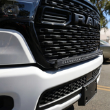 Close-up of the 40in SLIM light bar mounted along the bottom of the 2026 RAM 1500 HEMI grille