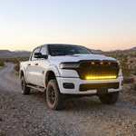 2026 RAM 1500 HEMI 40in light bar PRO lit yellow on a desert gravel trail at dusk