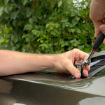 Installation of hood mount ditch lights on a 2024 Ford Ranger Raptor, showcasing hand tools and detailed work.