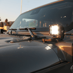 2019+ Jeep Gladiator ditch lights dual-color LED hood mount pod installed on driver side cowl for improved trail visibility