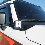 Land Cruiser ditch lights for 2024+ on white SUV with dual-color LEDs and amber DRL backglow