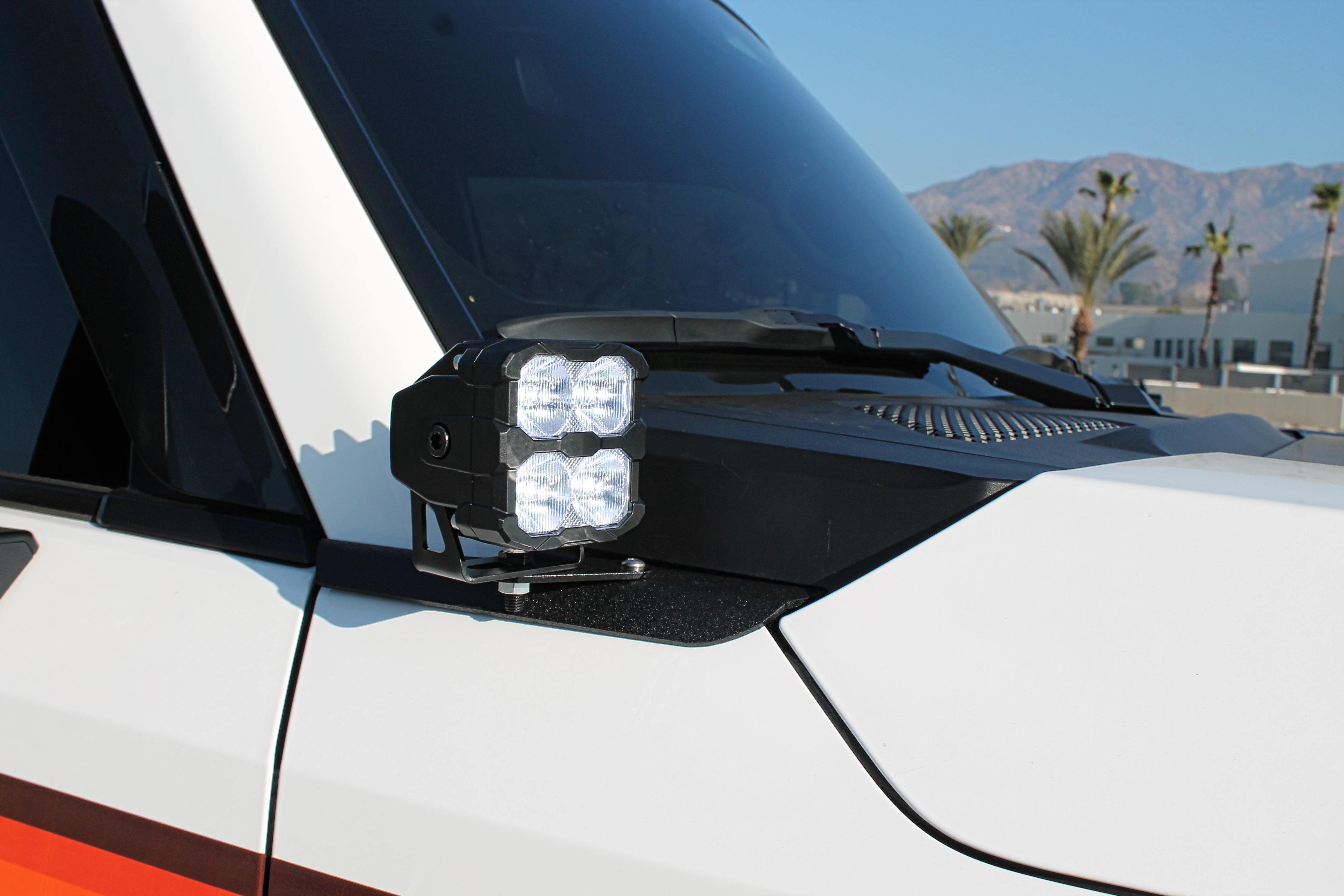 Land Cruiser ditch lights PRO on the front of a 2024+ Toyota Land Cruiser, dual-color white LED with amber DRL backglow