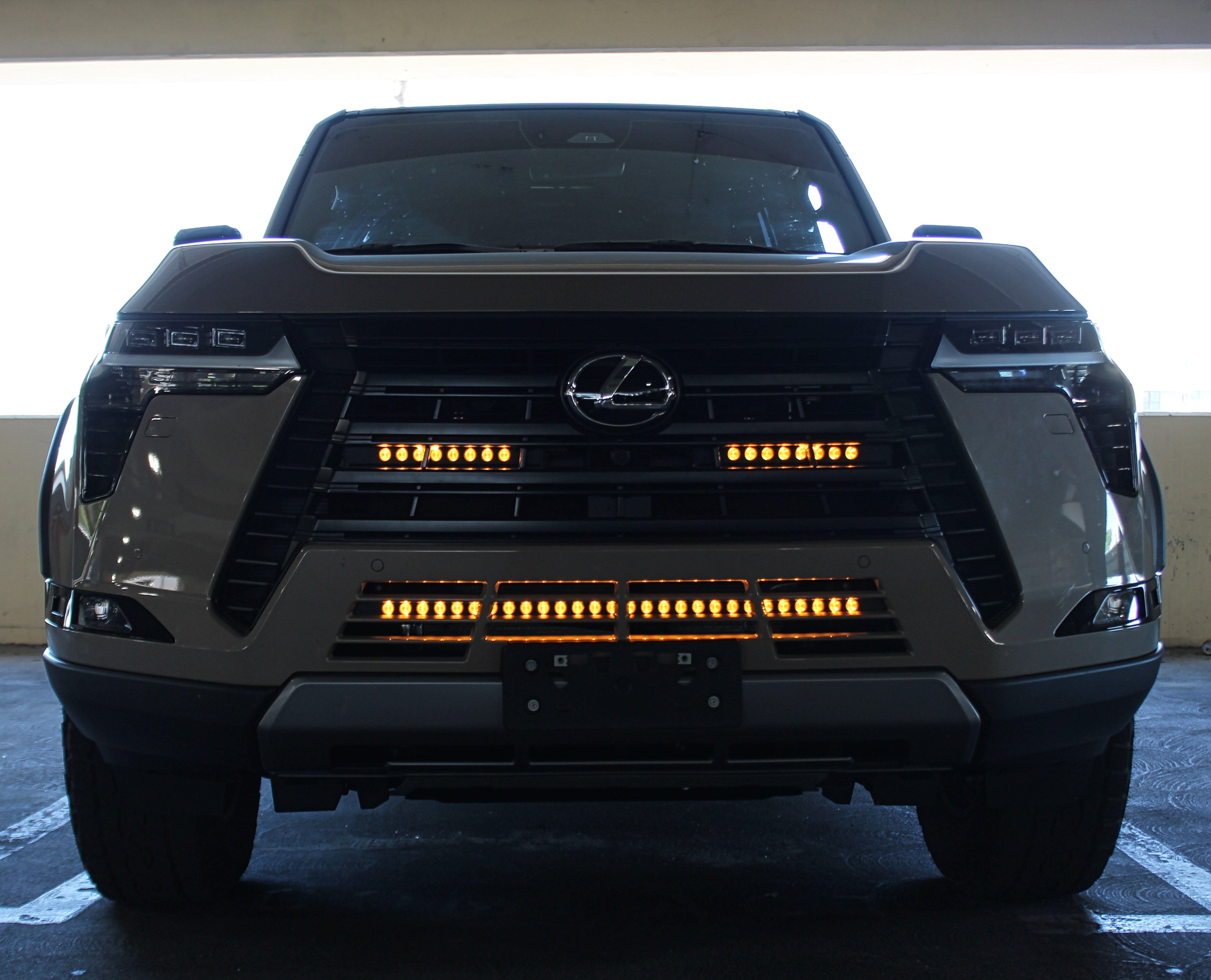 Lexus GX550 light bar behind grille—dual white/amber LED light bars on 2024+ GX550 Premium/Luxury/Overtrail models, 11in bars, installs behind lower grille on each side