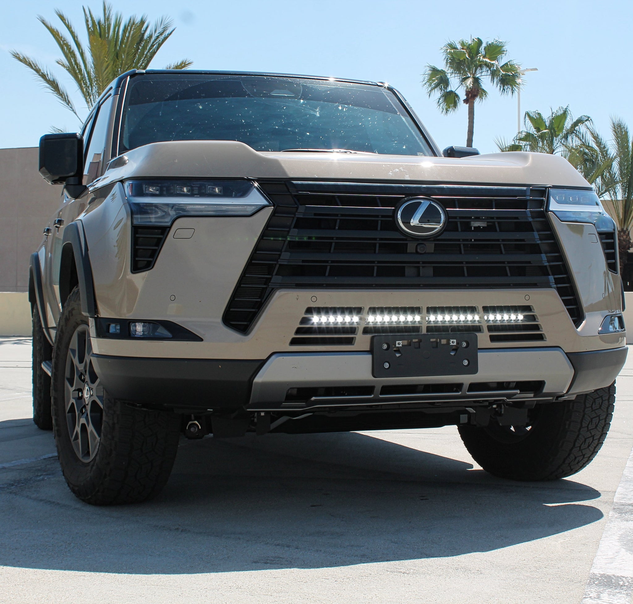 Lexus GX550 lightbar on 2024+ SUV front view with slim 30in light bar behind lower grille