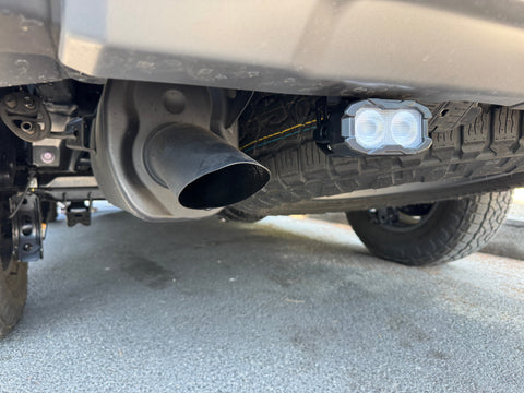 Lexus GX550 Reverse light kit for 2024+ shown installed under bumper with dual white LEDs and amber/red backlight option, pair included — fits GX550 Premium, Luxury, and Overtrail