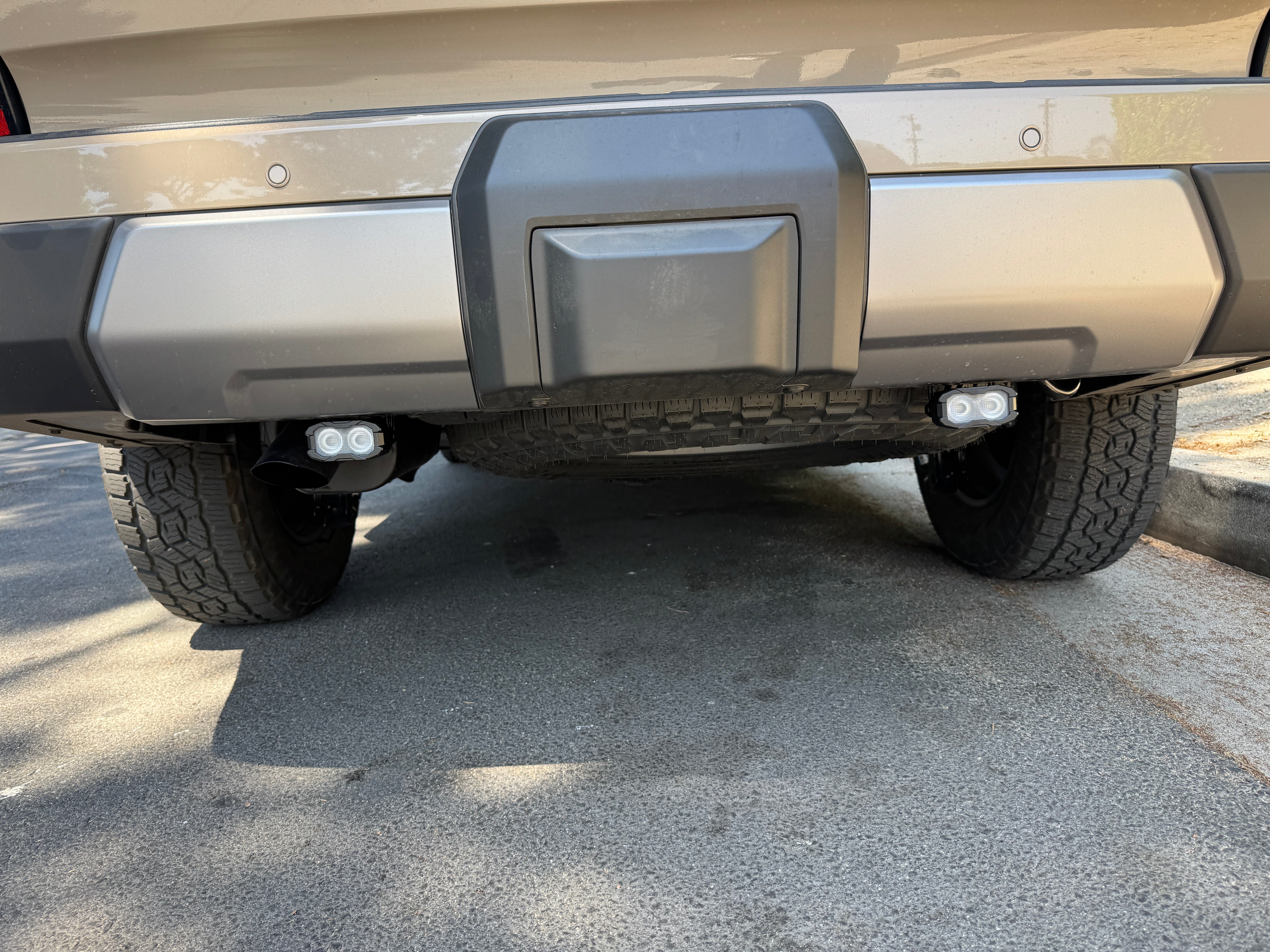 Lexus GX550 Reverse light kit - pair of white LED pods with amber or red backlight installed on rear bumper (fits 2024-2026 GX550 Premium/Luxury/Overtrail)