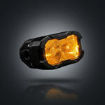 M&R Automotive reverse light LED pod with amber backlight illuminated, angled view of dual round lenses
