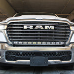 white 2025 ram 1500 with LED light bar on top bumper and fog lights