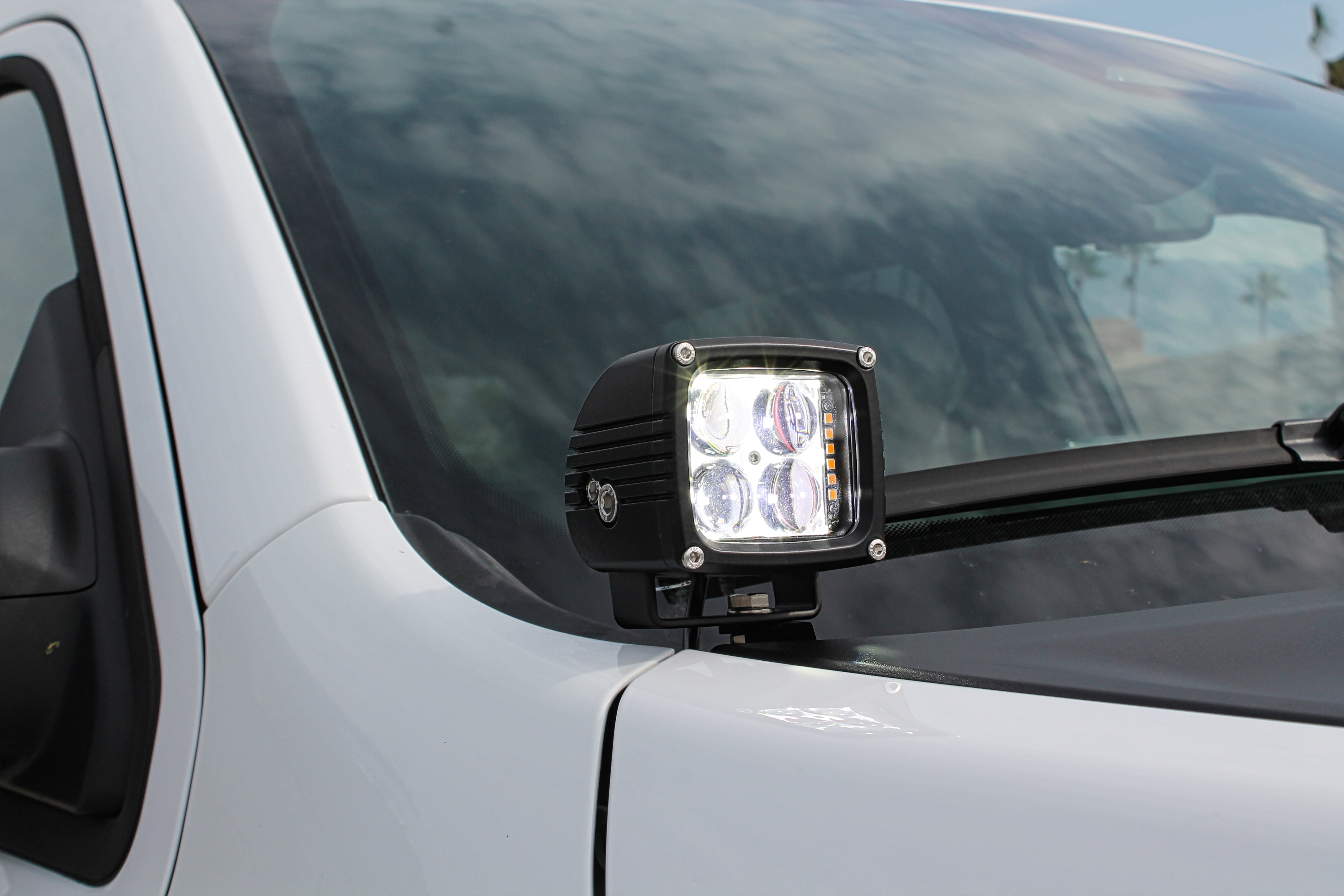 RAM 1500 dual-color ditch lights, white LED with amber DRL backglow on a 2025+ RAM 1500