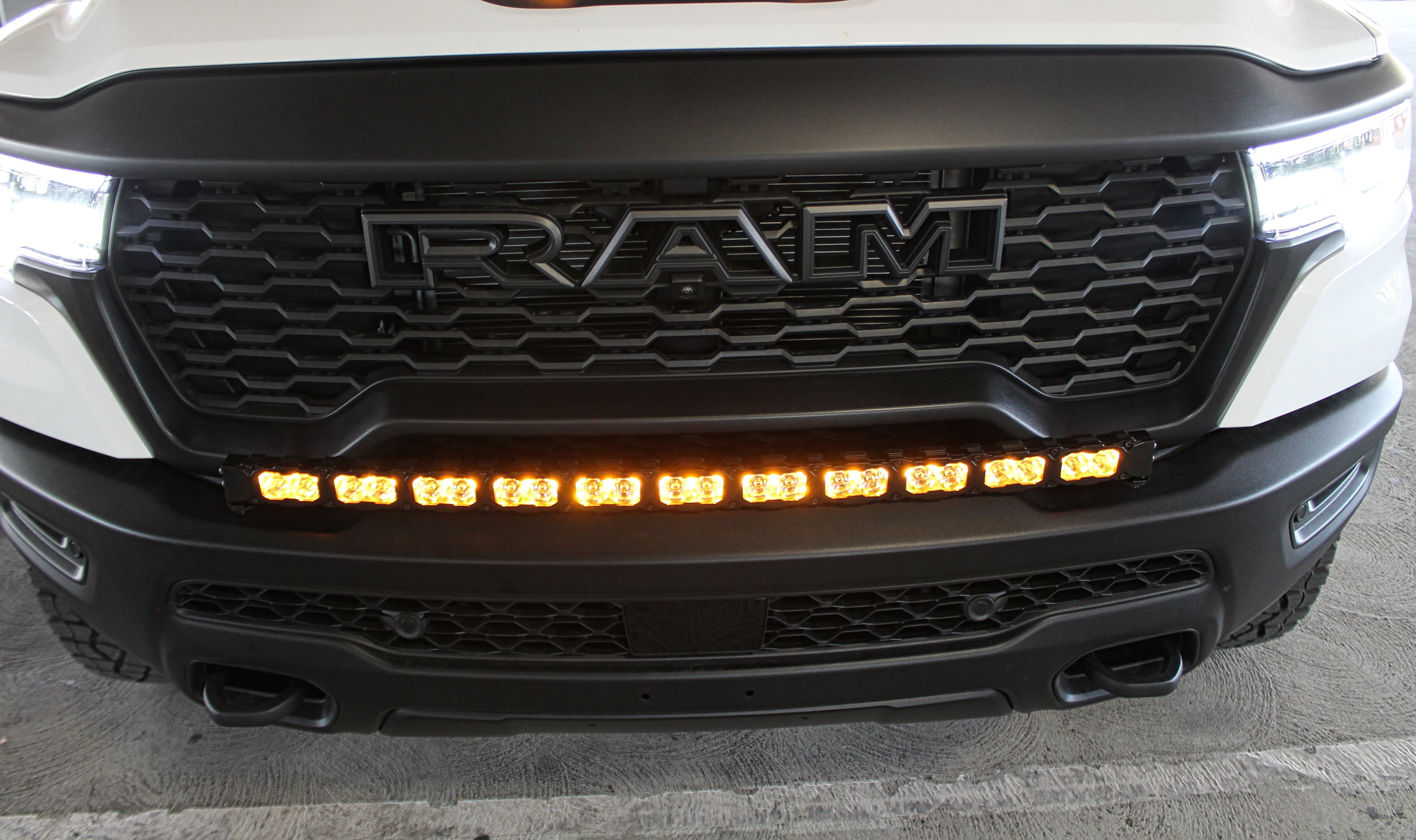 RAM REBEL lightbar on 2025 RAM 1500 Rebel — curved PRO LED bar integrates with factory bumper, slim built-in look, bolt-on installation