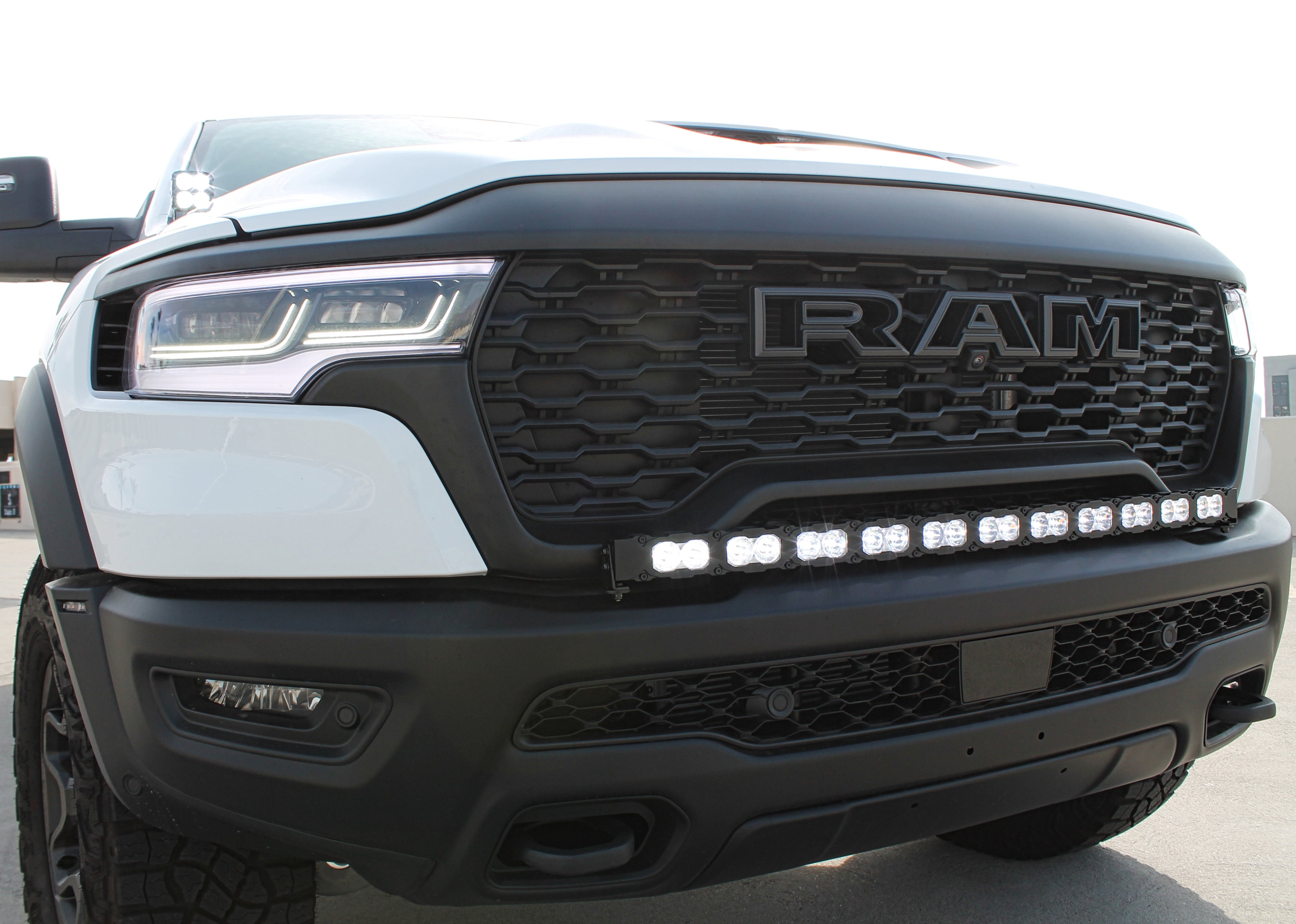 RAM REBEL lightbar RAM REBEL lightbar 40in installed on 2025 RAM 1500 Rebel bumper with curved LED bar and built-in look