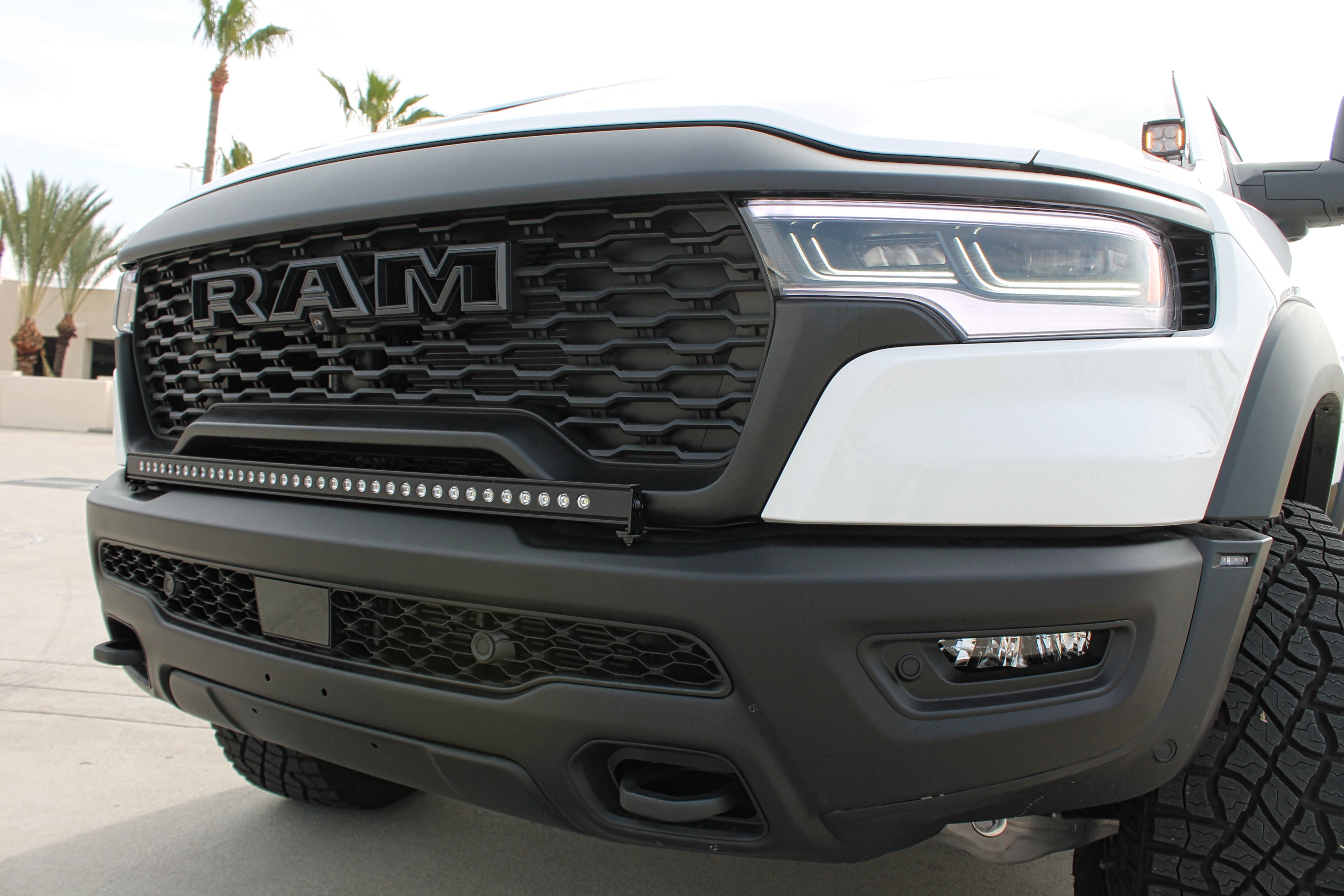 RAM RHO Lightbar on a RAM 1500 RHO front bumper with curved slim design, black powder-coated bracket, no grille cutting required