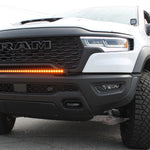 RAM RHO Lightbar on 2025+ RAM 1500 RHO, curved slim light bar following bumper curvature with black powder-coated bracket, no grille cut needed