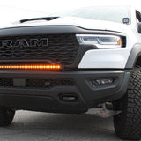 RAM RHO Lightbar on 2025+ RAM 1500 RHO, curved slim light bar following bumper curvature with black powder-coated bracket, no grille cut needed