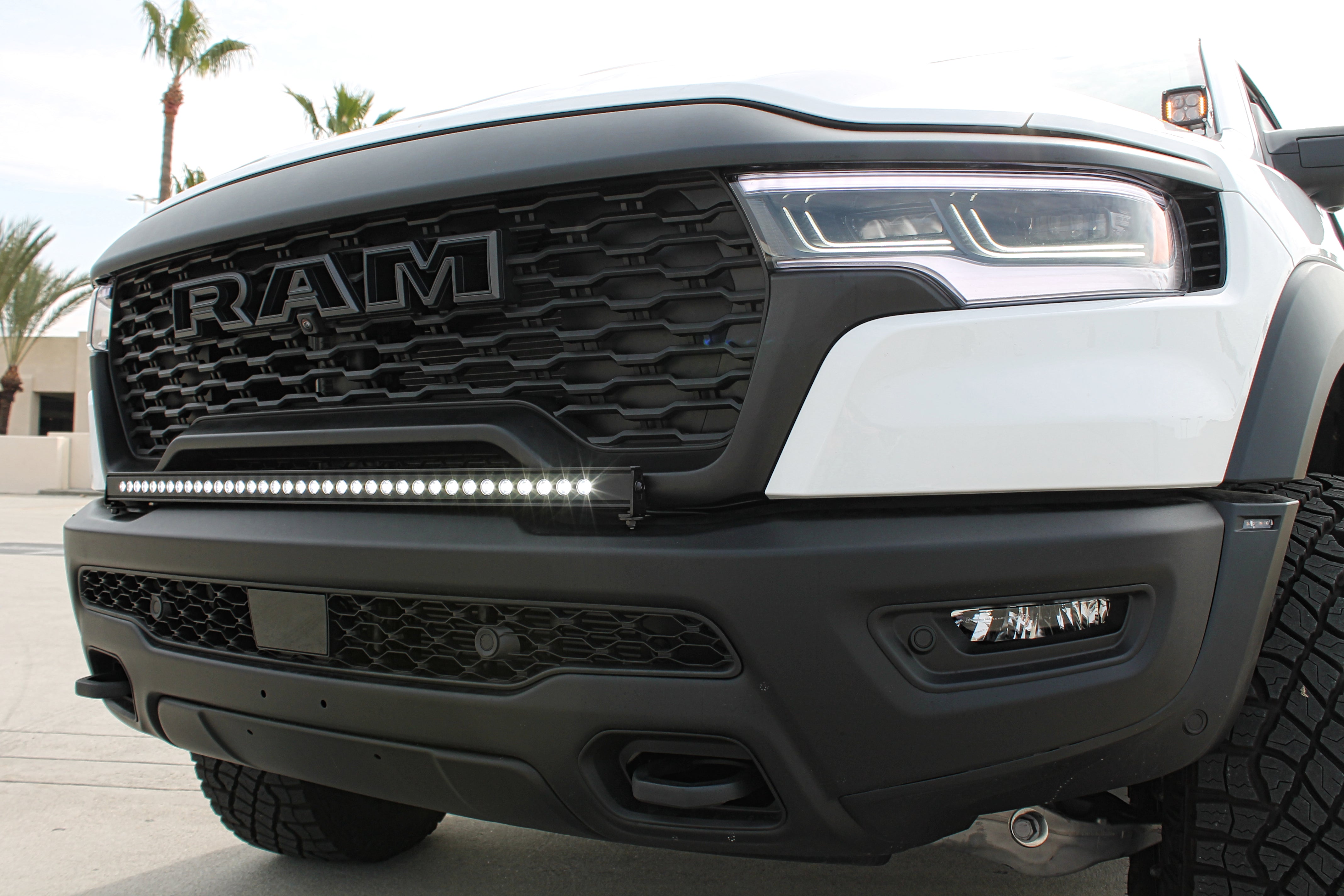 RAM RHO Lightbar 40in Slim on RAM 1500 RHO front bumper - curved light bar, black powder-coated bracket, no grille cutting, slim built-in look