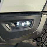 RAM RHO FOG LED fog light kit on 2025+ RAM 1500; Driver side and Passenger side installed, black powder-coated bracket, bolt-on installation with no cutting