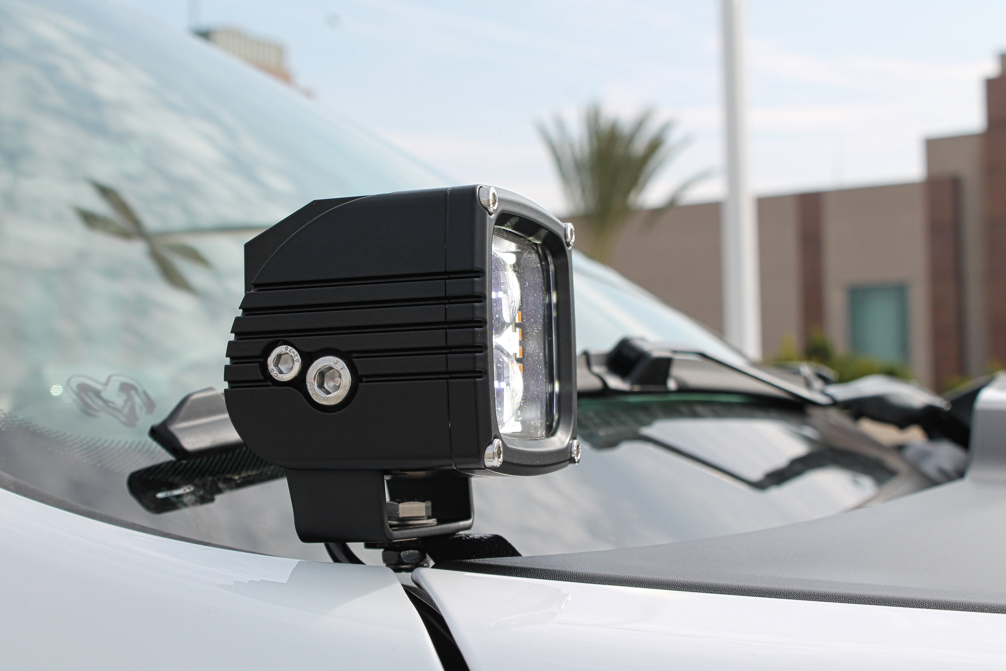 RAM RHO Ditch Lights Dual Color with white LED and amber DRL backglow on a RAM 1500 2025+ vehicle