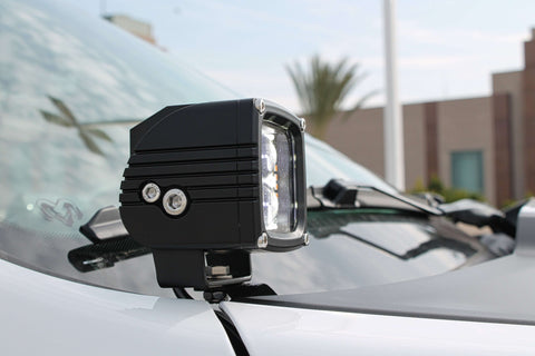 RAM RHO Ditch Lights Dual Color with white LED and amber DRL backglow on a RAM 1500 2025+ vehicle