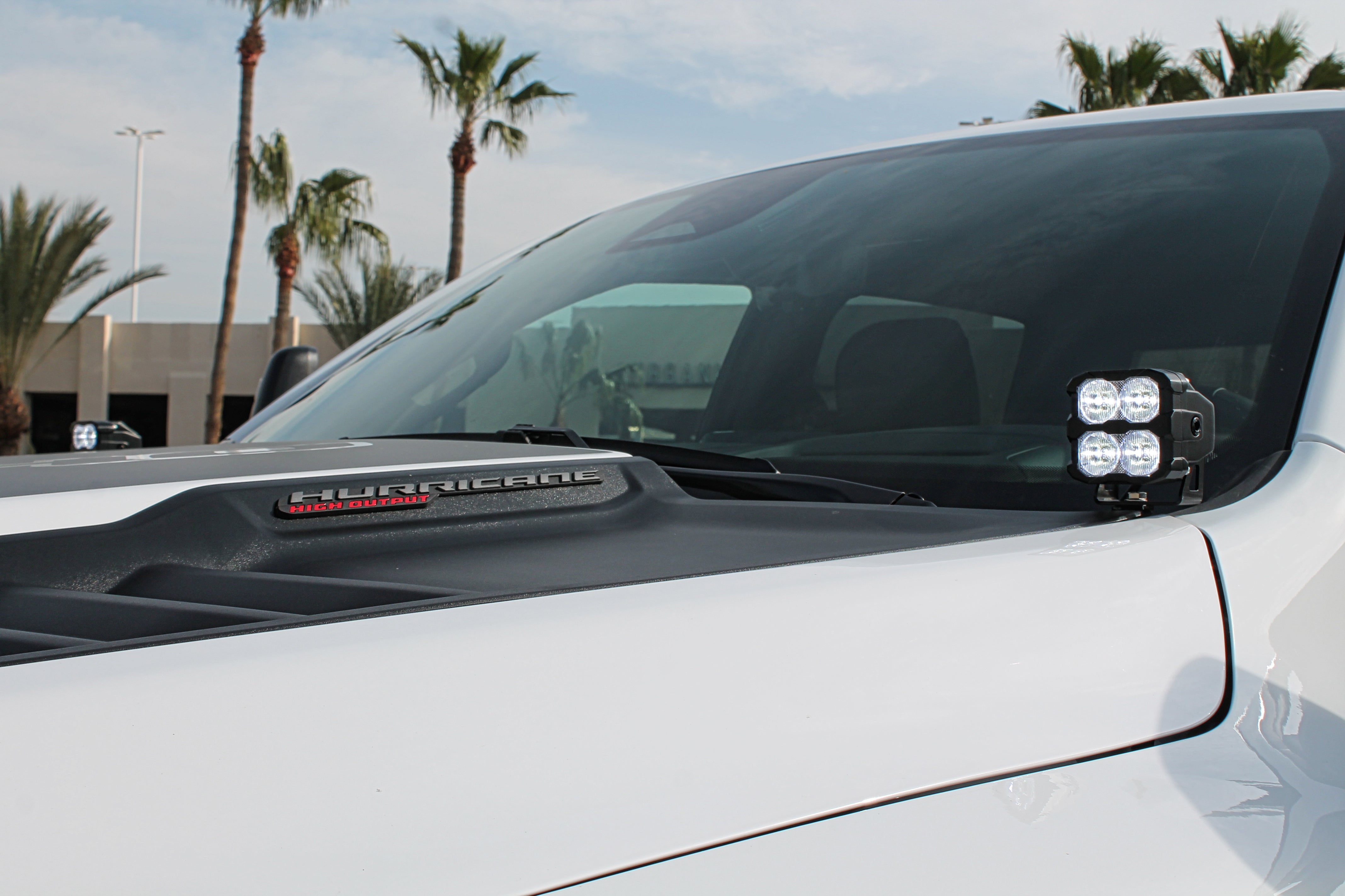 RAM RHO Ditch Lights on a RAM 1500 2025+ - dual color white LED with amber DRL backglow on hood
