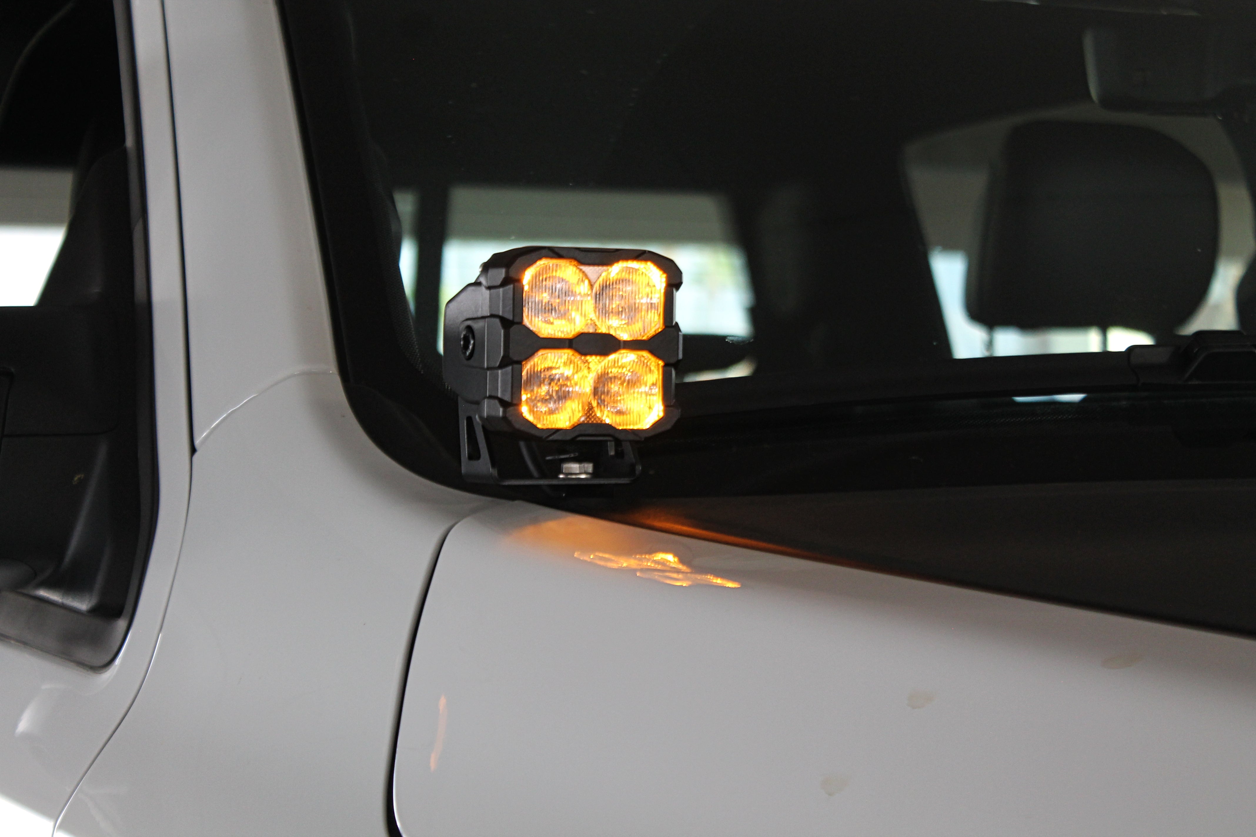 RAM RHO Ditch Lights - PRO 2025+ RAM RHO Ditch Lights on white truck with dual white and amber DRL glow