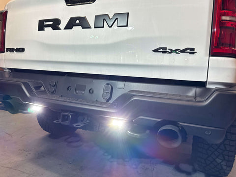 RAM RHO REVERSE Reverse Light Kit logo on RAM pickup, back view with dual white LEDs and amber/red backlight options