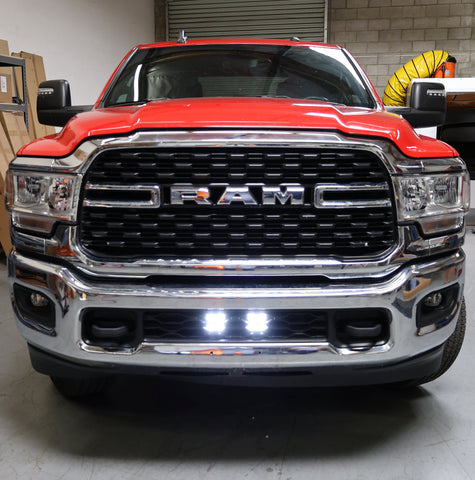 RAM 2500 lightbar Bumper Light kit installed on 2019-2024 RAM 2500 lower grille with bright LED light pods on