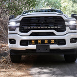 2025+ RAM 2500 Light kit lower grille LED pod lights installed on white RAM 2500 truck front view