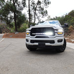 2025+ RAM 2500 light bar 40in PRO curved LED installed on white RAM 2500 truck front view on mountain road