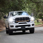 2025+ RAM 2500 light bar 40in PRO curved LED grille light bar on white RAM 2500 truck driving on forest road