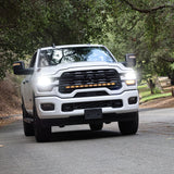 2025+ RAM 2500 light bar 40in PRO curved LED grille light bar on white RAM 2500 truck driving on forest road