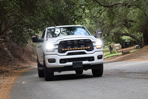 2025+ RAM 2500 light bar 40in PRO curved LED grille light bar on white RAM 2500 truck driving on forest road